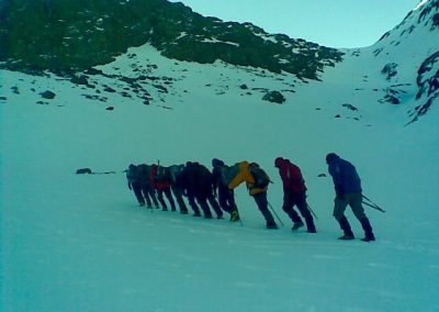 Trekking through the snow on a private guided winter trek to Jebel Toubkal with Experience Morocco