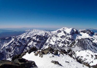 Snowy peaks in the High Atlas Mountains of Morocco as seen from Jebel Toubkal summit.