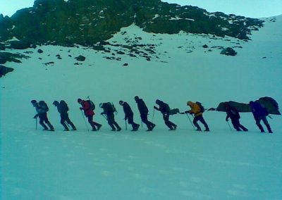 Trekking through the snow on a private guided winter trek to Jebel Toubkal with Experience Morocco