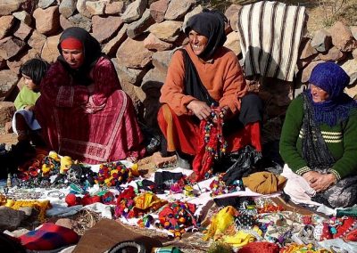 Berber nomad women selling locally made products in Jebel Saghro mountain range in Morocco