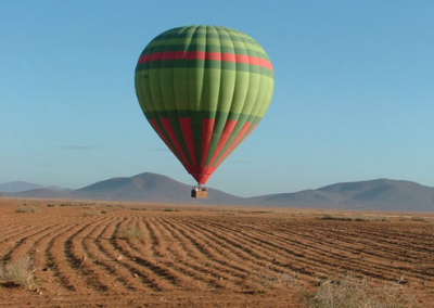Hot air balloon landing in the countryside near Marrakech
